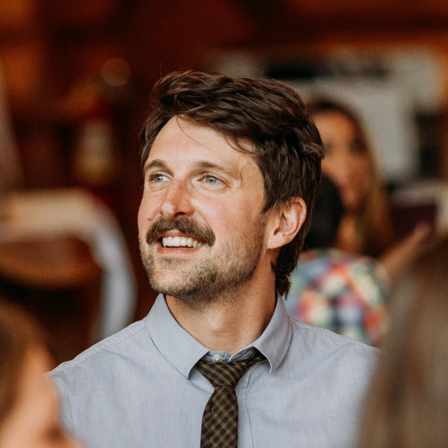 Devon de Balasi Brown smiling and looking to the side